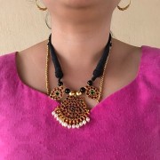 kemp Stone black thread necklace